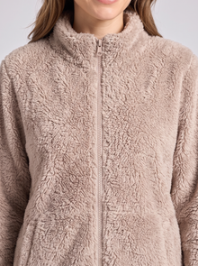 Fluffy sherpa texture and zip – close-up