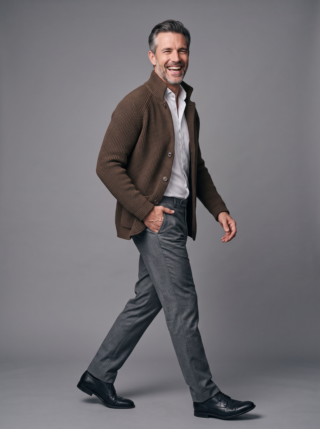 Man walking in a knitted button-front cardigan, side view