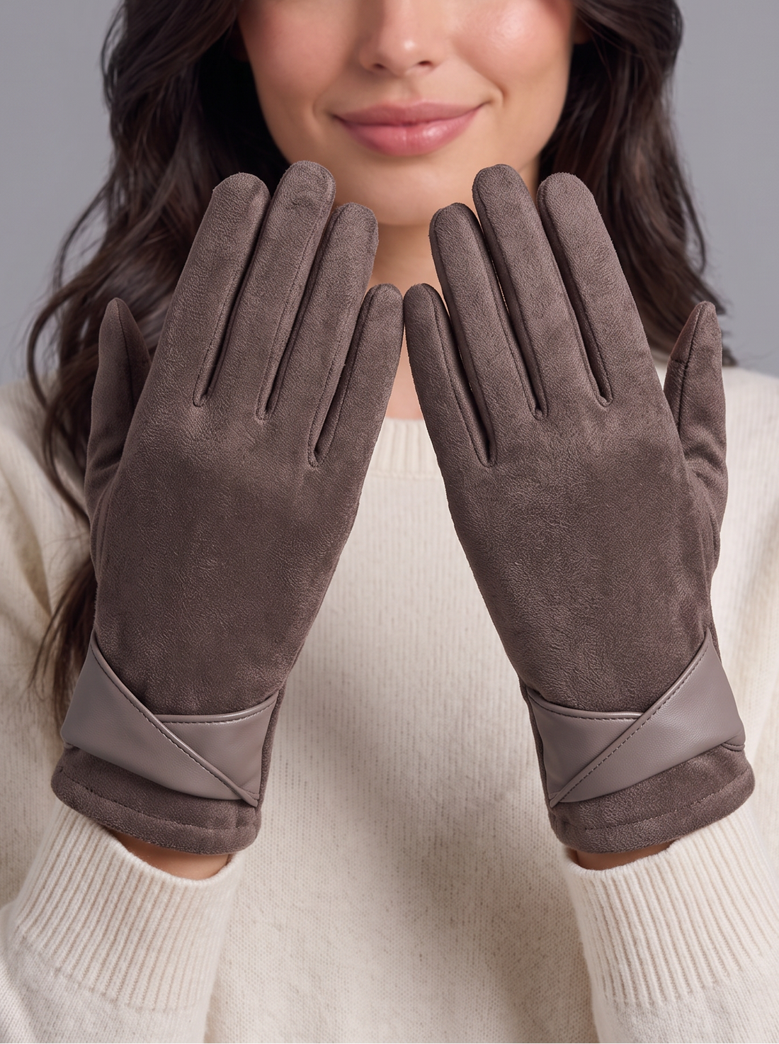 Woman wearing mocha brown fleece-lined touchscreen gloves, hands raised to show the velvet-touch finish