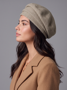 Side profile of a woman wearing a khaki knitted beret