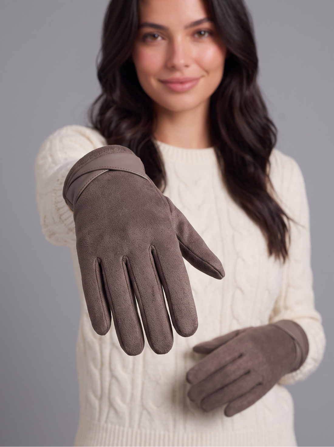 Woman wearing mocha brown fleece-lined touchscreen gloves, hands raised to show the velvet-touch finish