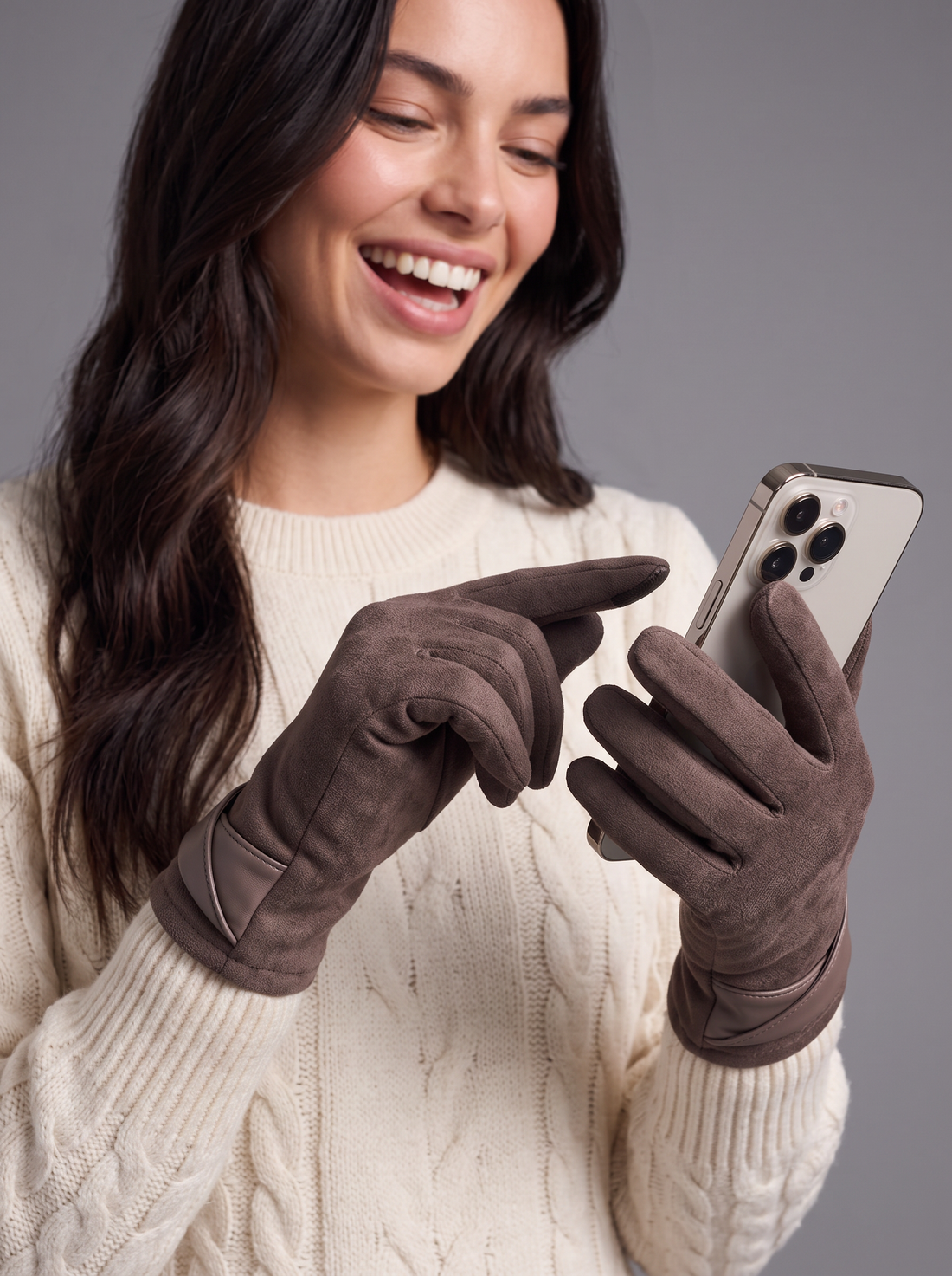 Woman using a smartphone with mocha touchscreen gloves on