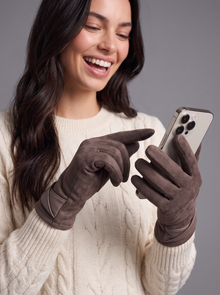 Woman using a smartphone with mocha touchscreen gloves on
