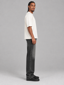 Men's black vintage wash relaxed straight-leg jeans – side view