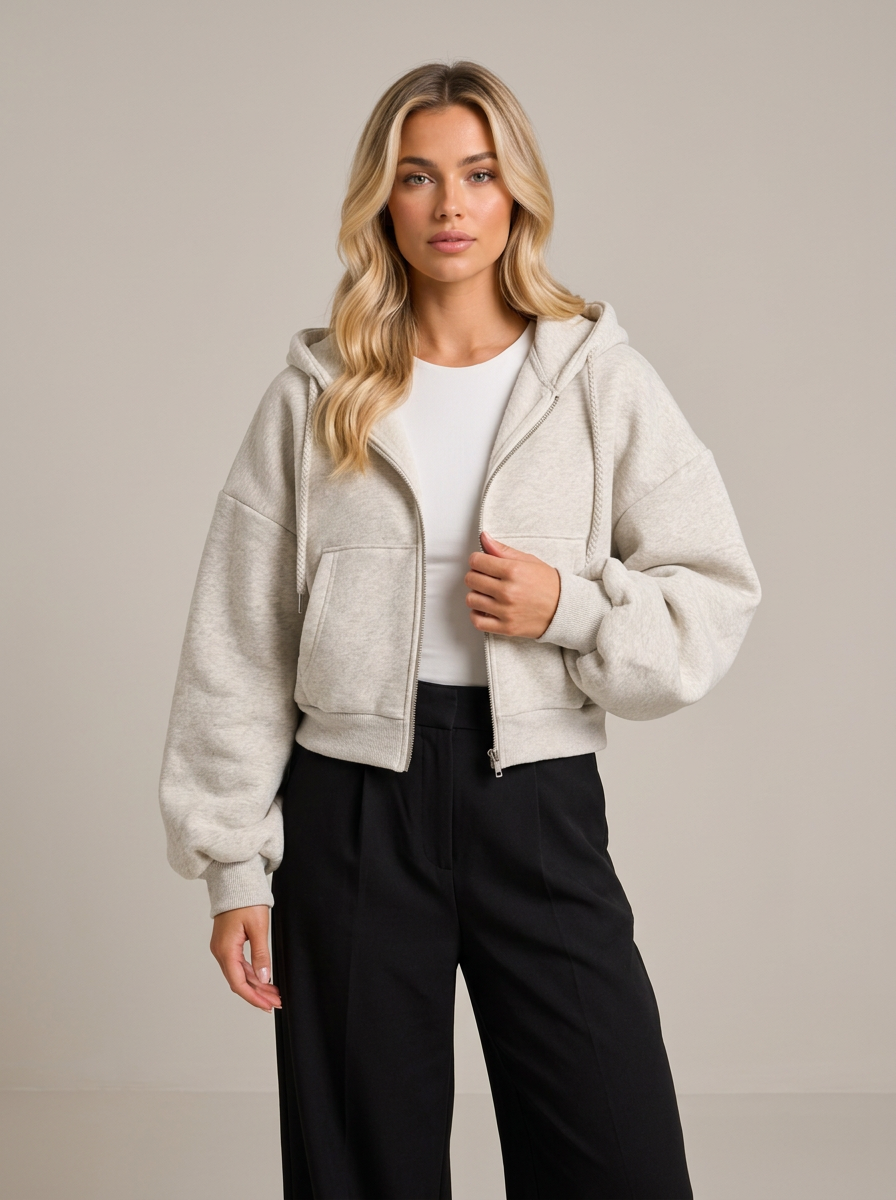 Woman wearing flower grey cropped zip-up fleece-lined hoodie, front view