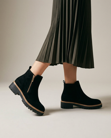 Women's black waterproof orthopaedic ankle boots, on-model view