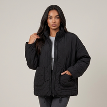 Women's black quilted funnel neck jacket