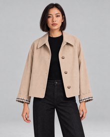 Women's cropped trench jacket with plaid lining in beige – front view