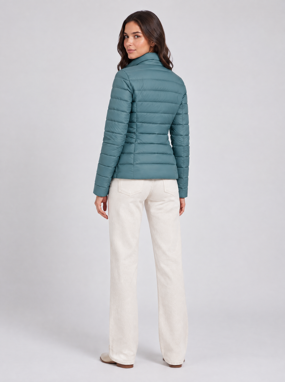 Women’s blue lightweight puffer jacket, back view