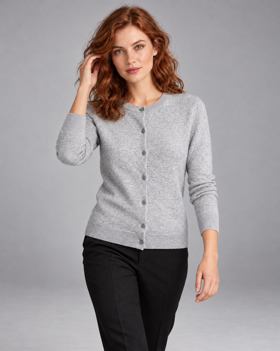 Women's merino wool crew-neck cardigan in grey – walking view