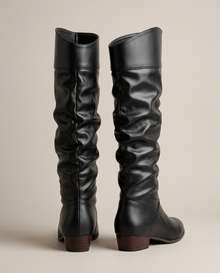 Black slouch knee-high boots, rear heel view