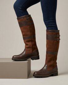 Brown waterproof leather knee-high boots, on-model studio view